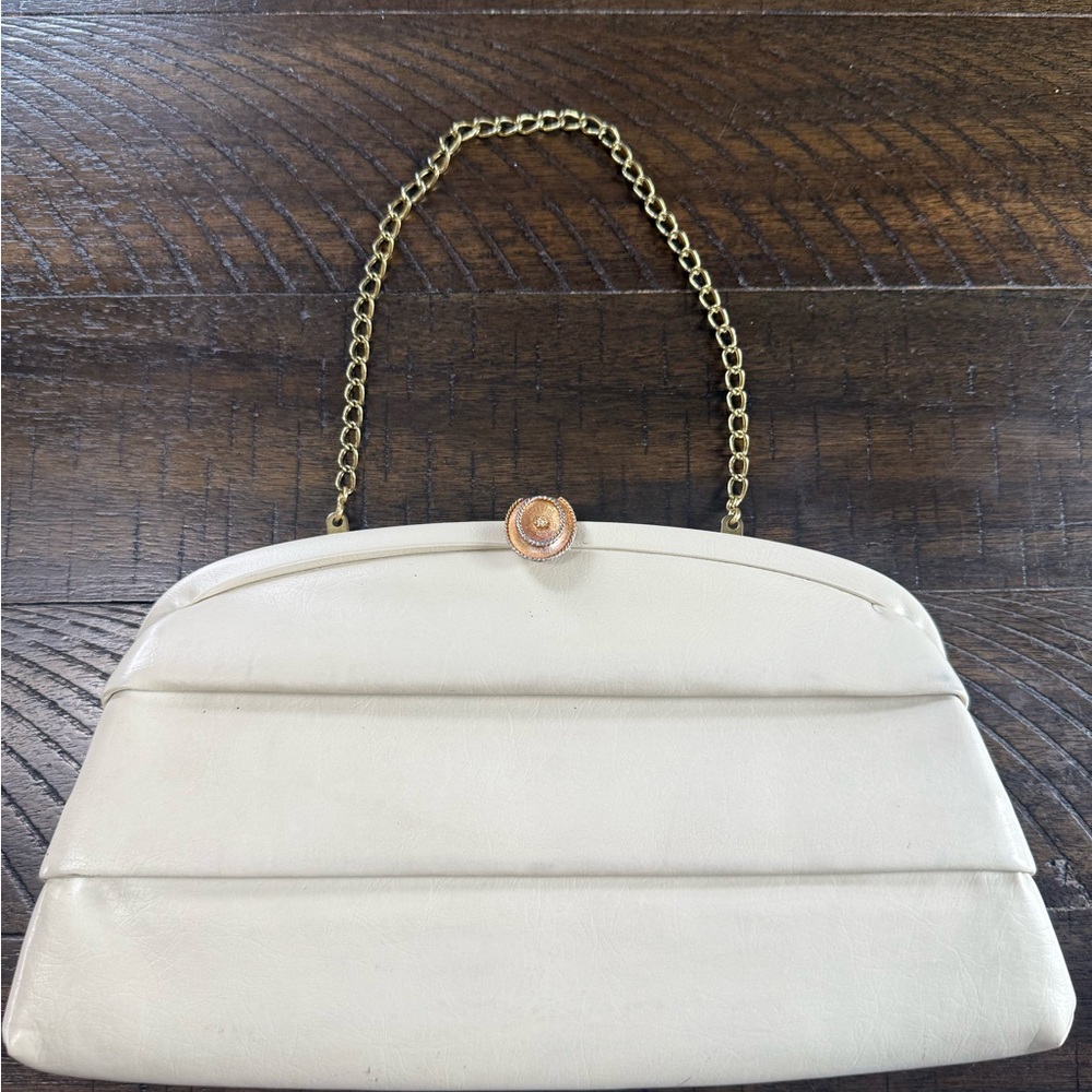 Vintage Chic cream clutch With gold chain.